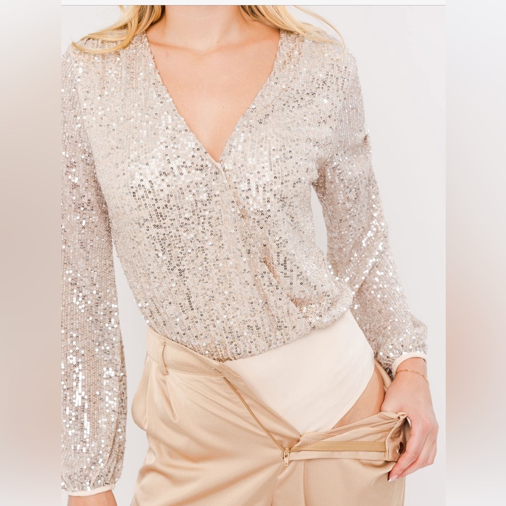 Long sleeve wrap sequin bodysuit… one left, size large Holiday staple piece!